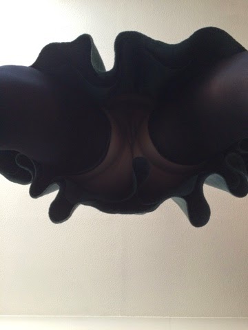 A photo taken up my skirt. I'm wearing hold up stockings, but not much else. 