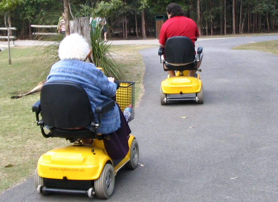 Old people on mobility scooters