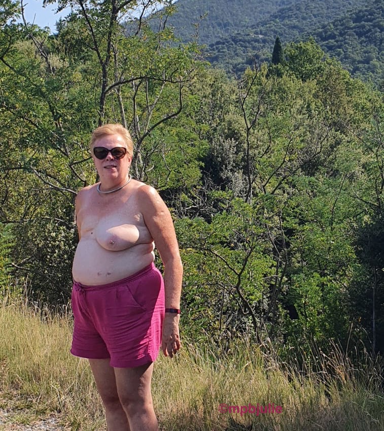 Me, topless by the roadside in the French Pyrenees. I'm wearing pink shorts