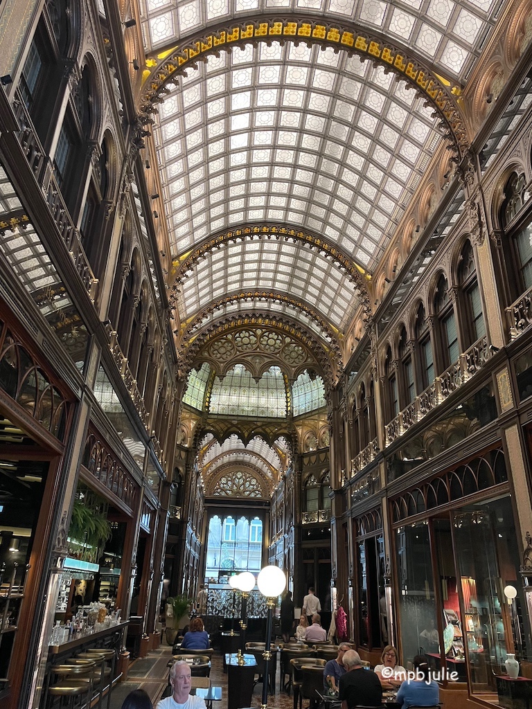 Inside an art nouveau hotel with domed glass roof. It's a cafe