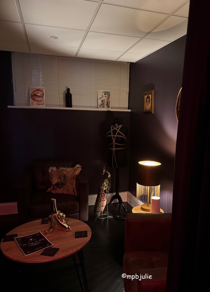 A sitting area with chairs, table etc.